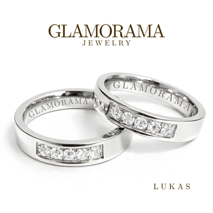 Two silver rings with diamond accents from Glamorama Jewelry on a white background.
