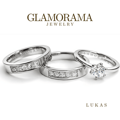 Glamorama jewelry with three silver rings on a white background