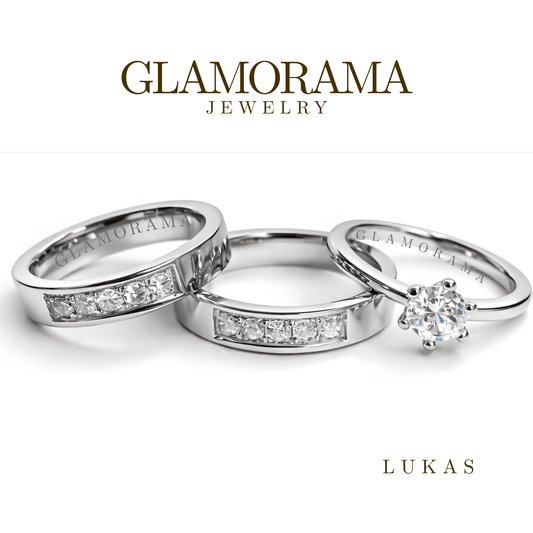 Glamorama jewelry with three silver rings on a white background